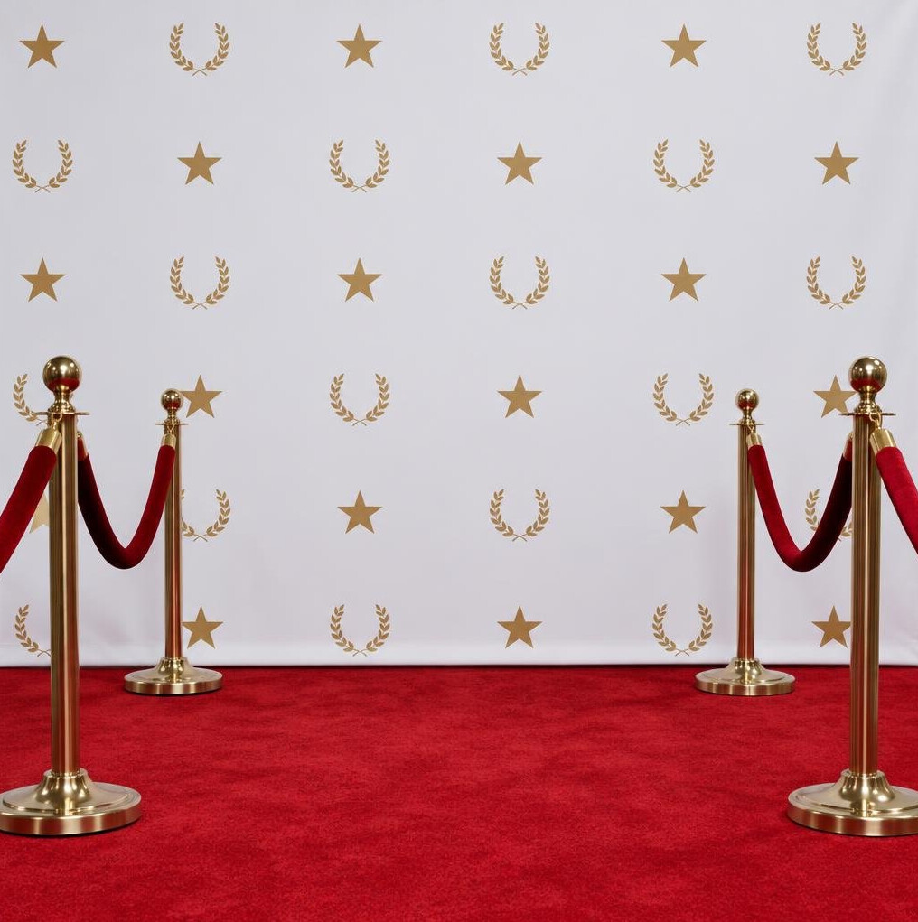 Red carpet step-and-repeat backdrop with press line stanchions